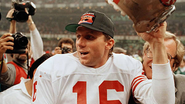 Super Bowl XXIII: San Francisco 49ers owner Edward J. DeBartolo hugs 49ers center Randy Cross, right, after the 49ers victory over the Cincinnati Bengals in SuperBowl XXIII in Miami Sunday, Jan. 22, 1989. Cross has announced plans to retire after this season